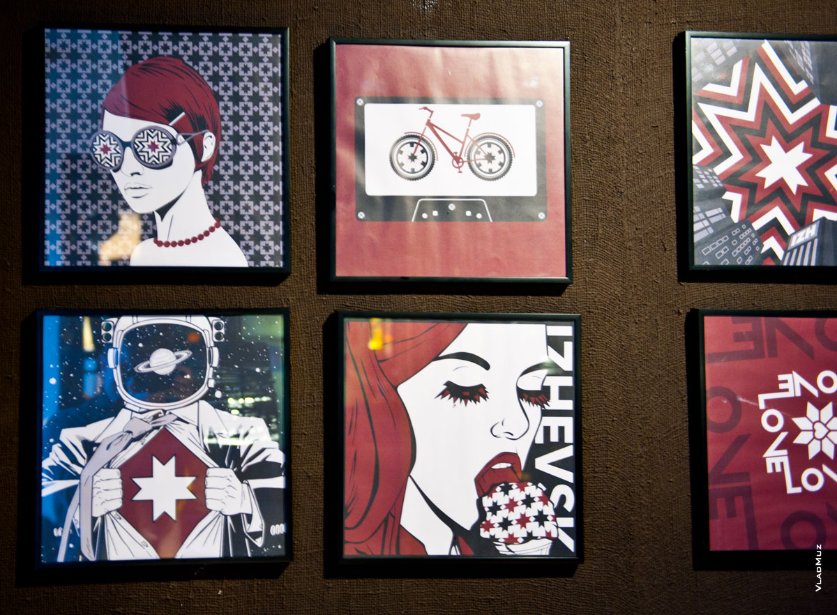 Дизайнерские иллюстрации с солярными символами в интерьере кафе города Ижевска